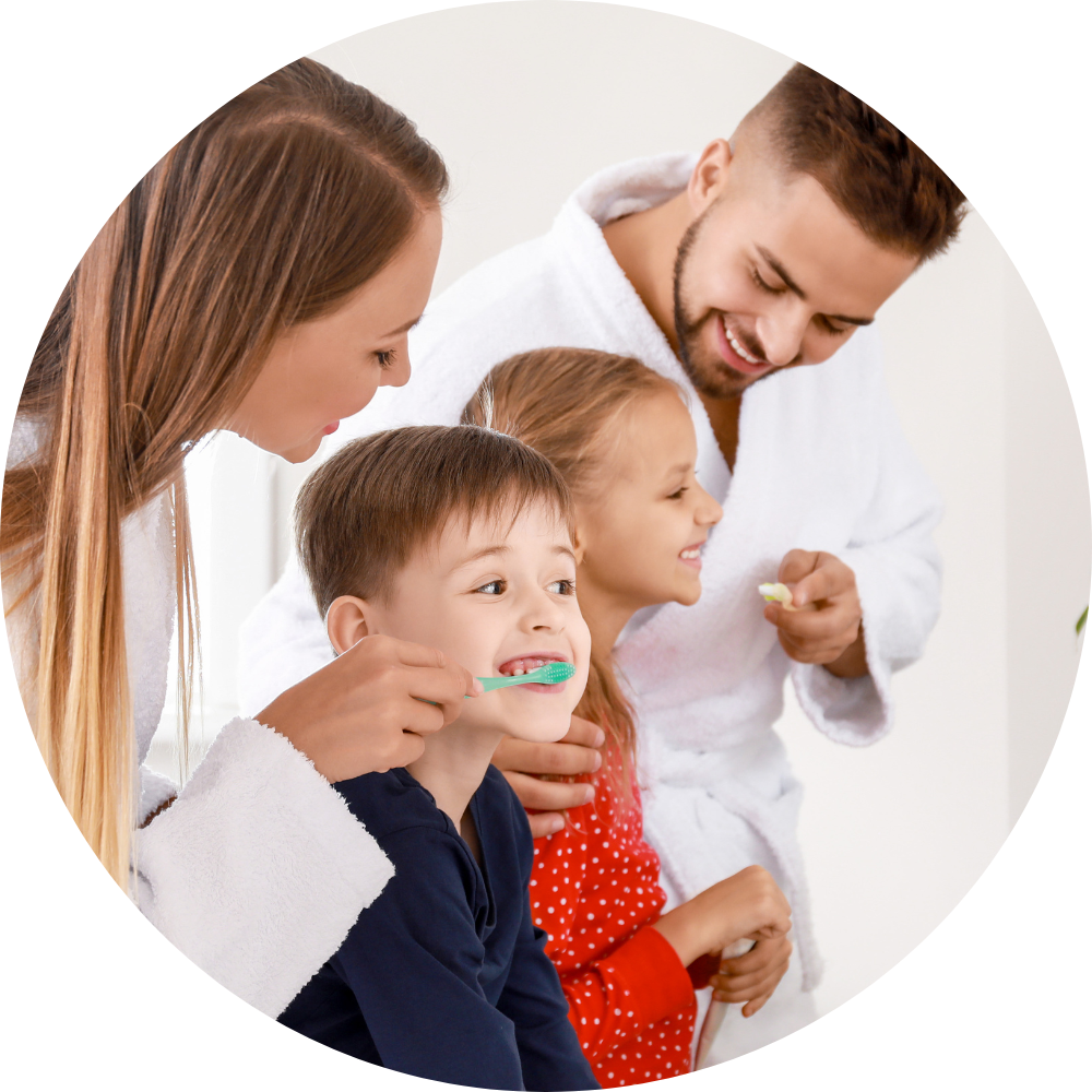 Adults Helping Children Brush Teeth | Pediatric Dentist | Alexandria VA