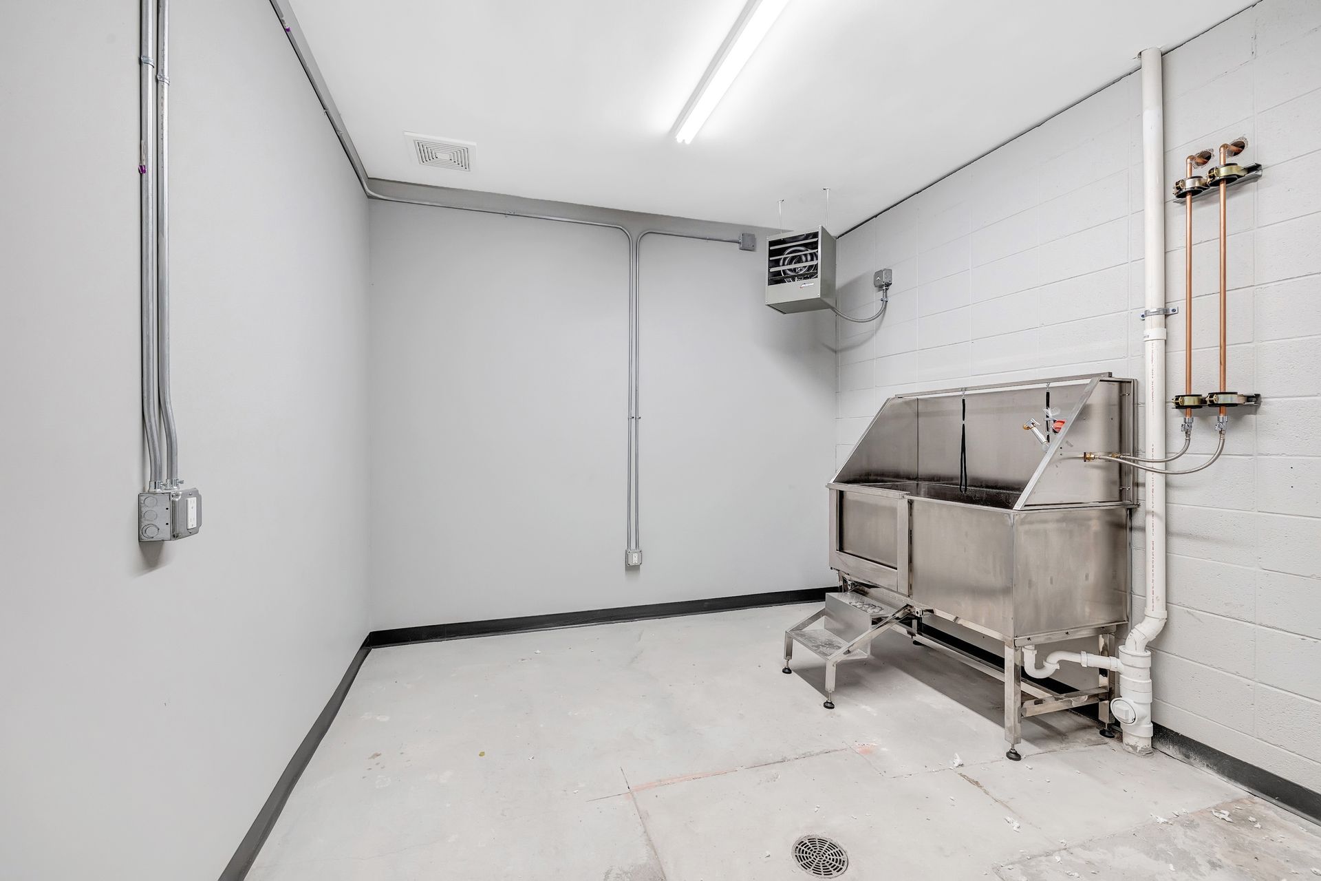 There is a sink in the middle of the room.