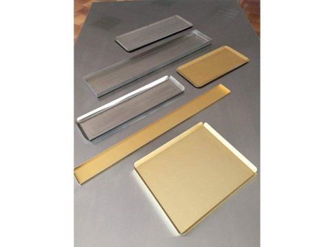 Golden aluminium trays of various sizes