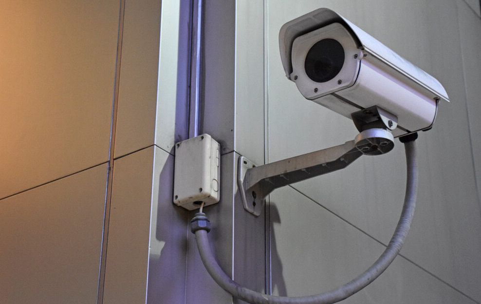 A Security Camera Is Mounted On The Side Of A Building — Dateline Computers Authorised Jaycar Reseller In Proserpine, QLD