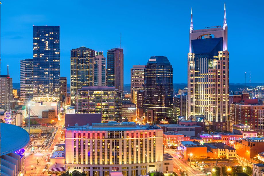 An aerial view of a city skyline at night.