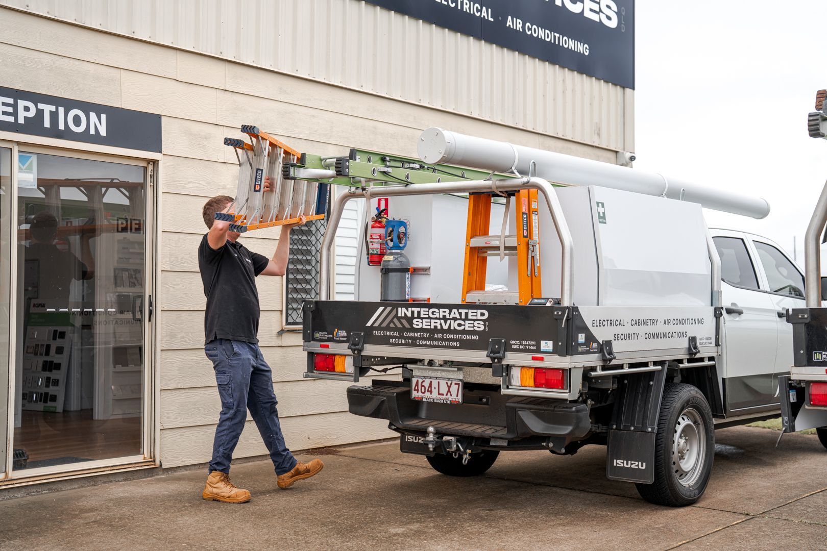 Team member loading ute at Integrated Services showroom in Toowoomba