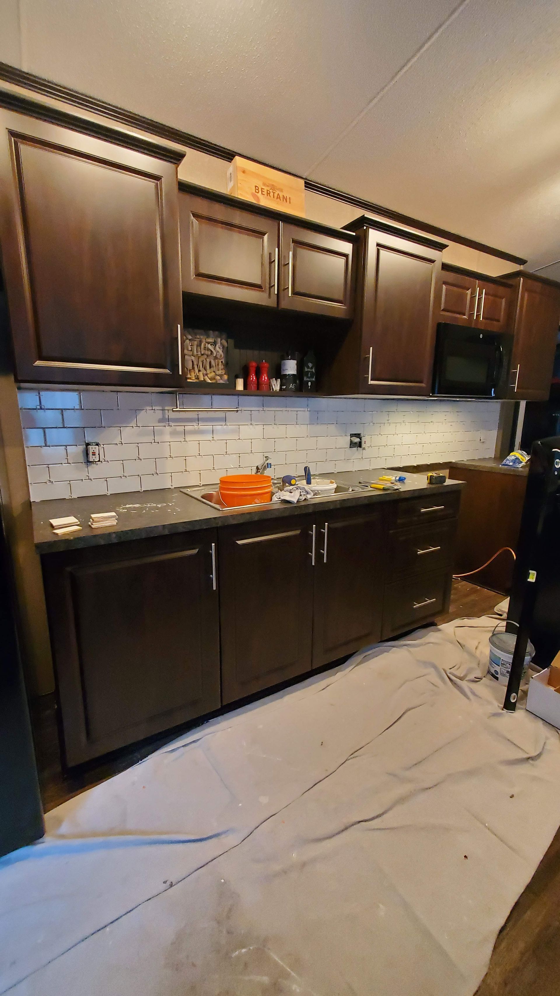 A kitchen with a lot of cabinets and a sink.