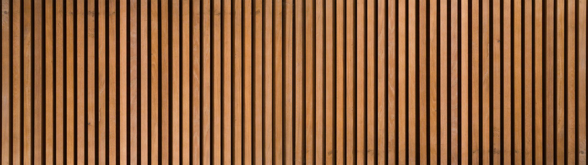 A close up of a wooden wall with a striped pattern.