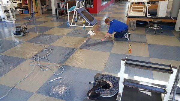 Tile Cleaning Service — Man Cleaning Floor in Essex Junction, VT