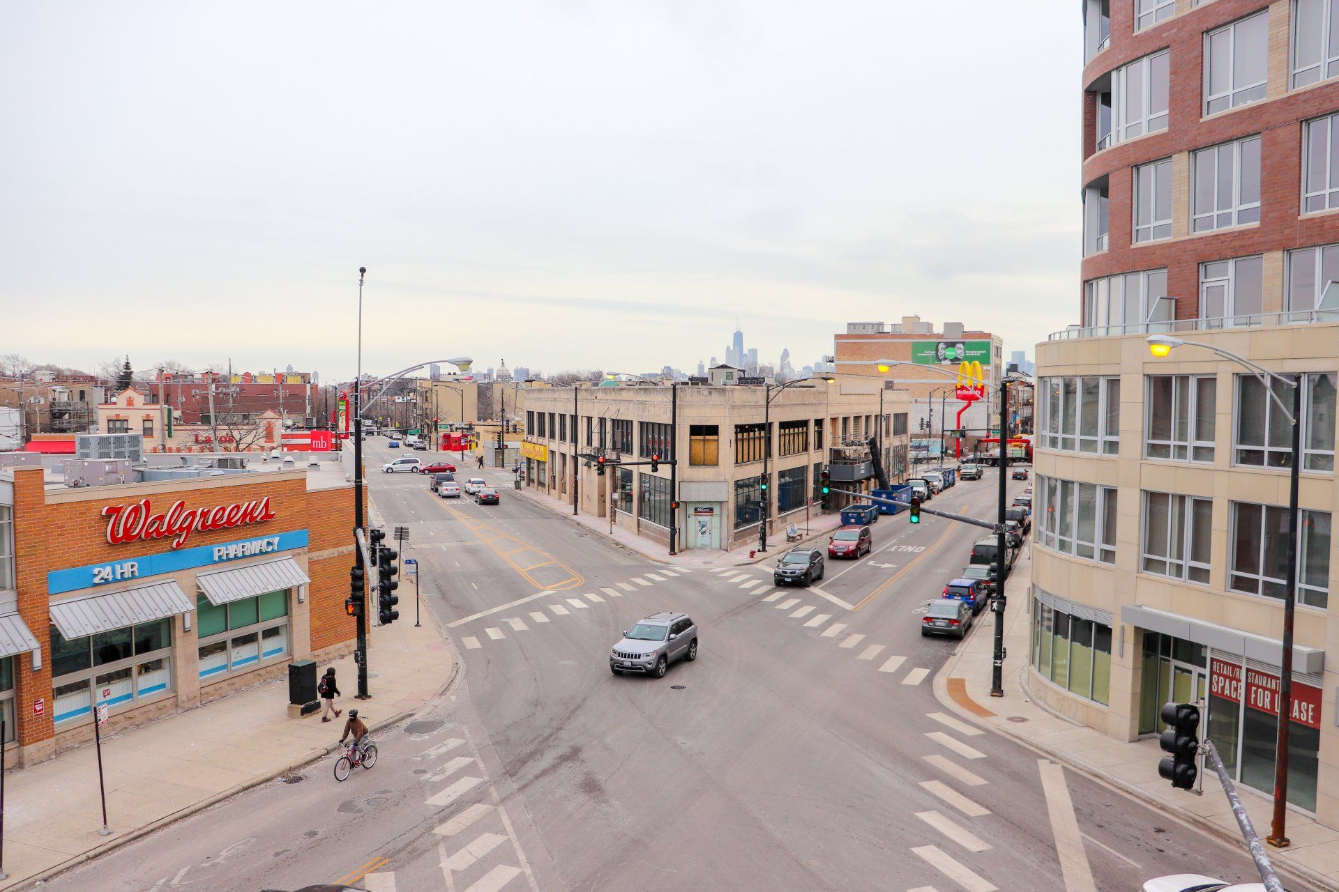An aerial view of a busy intersection in a city at 2000 N Milwaukee Apartments.