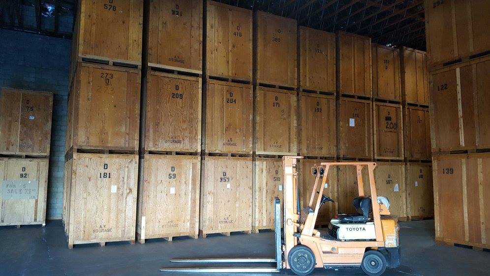 Man Stacking Up Boxes — Palmdale, CA — Antelope Valley Van & Storage