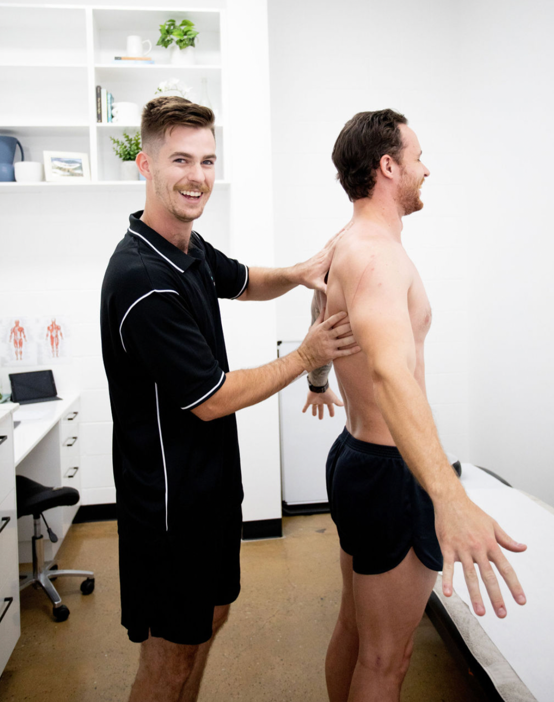 physiotherapist touching mans back — Inner Balance Health in Darwin