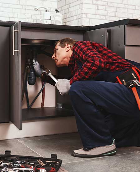 Plumbing Checking The Sink Pipes — Vestal, NY — Baker’s Plumbing Heating & Air Plumbing Checking The Sink Pipes — Vestal, NY — Baker’s Plumbing Heating & Air