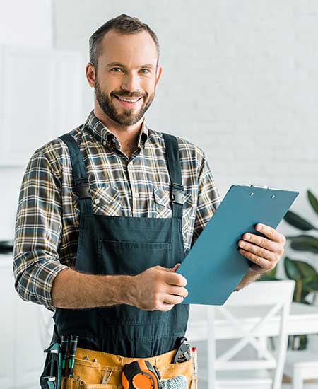Plumber With His Tools Around His Waist — Vestal, NY — Baker’s Plumbing Heating & Air Plumber With His Tools Around His Waist — Vestal, NY — Baker’s Plumbing Heating & Air