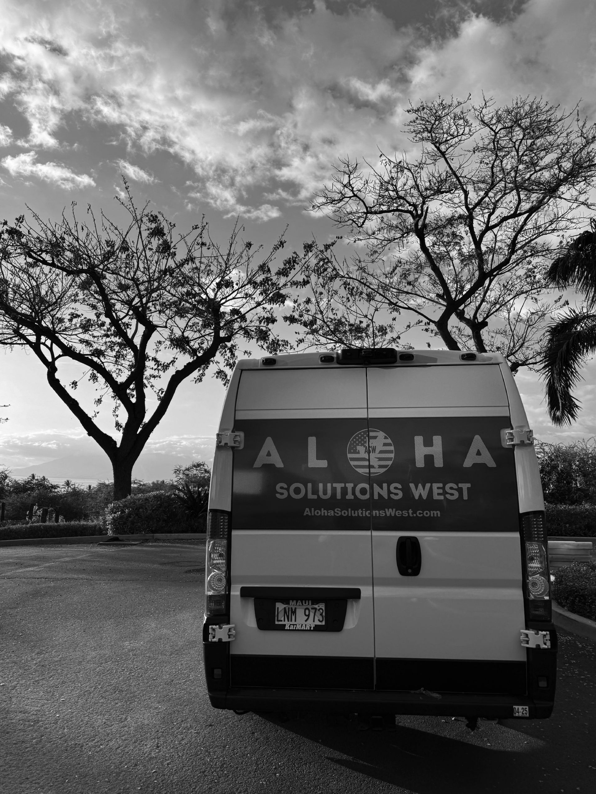 Black and white photo of a van with 