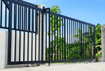 aluminum gate automatic closing and installed to protect a driveway