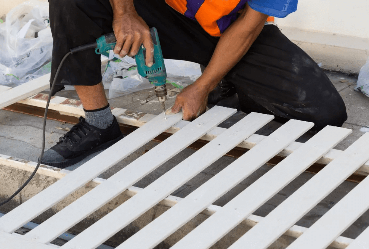 installing a white picket fence with pre-primered fence posts