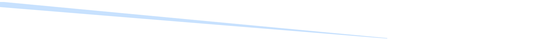 Blurred, light-colored diagonal shape against a white background.