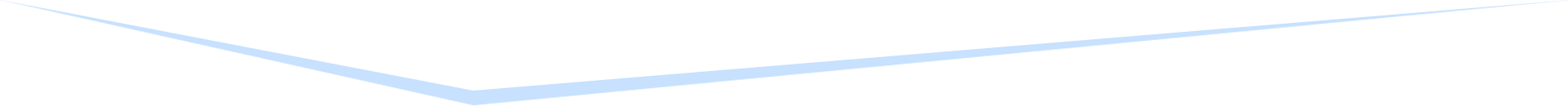 A blurred, angled view of a white, geometric structure with multiple layers.