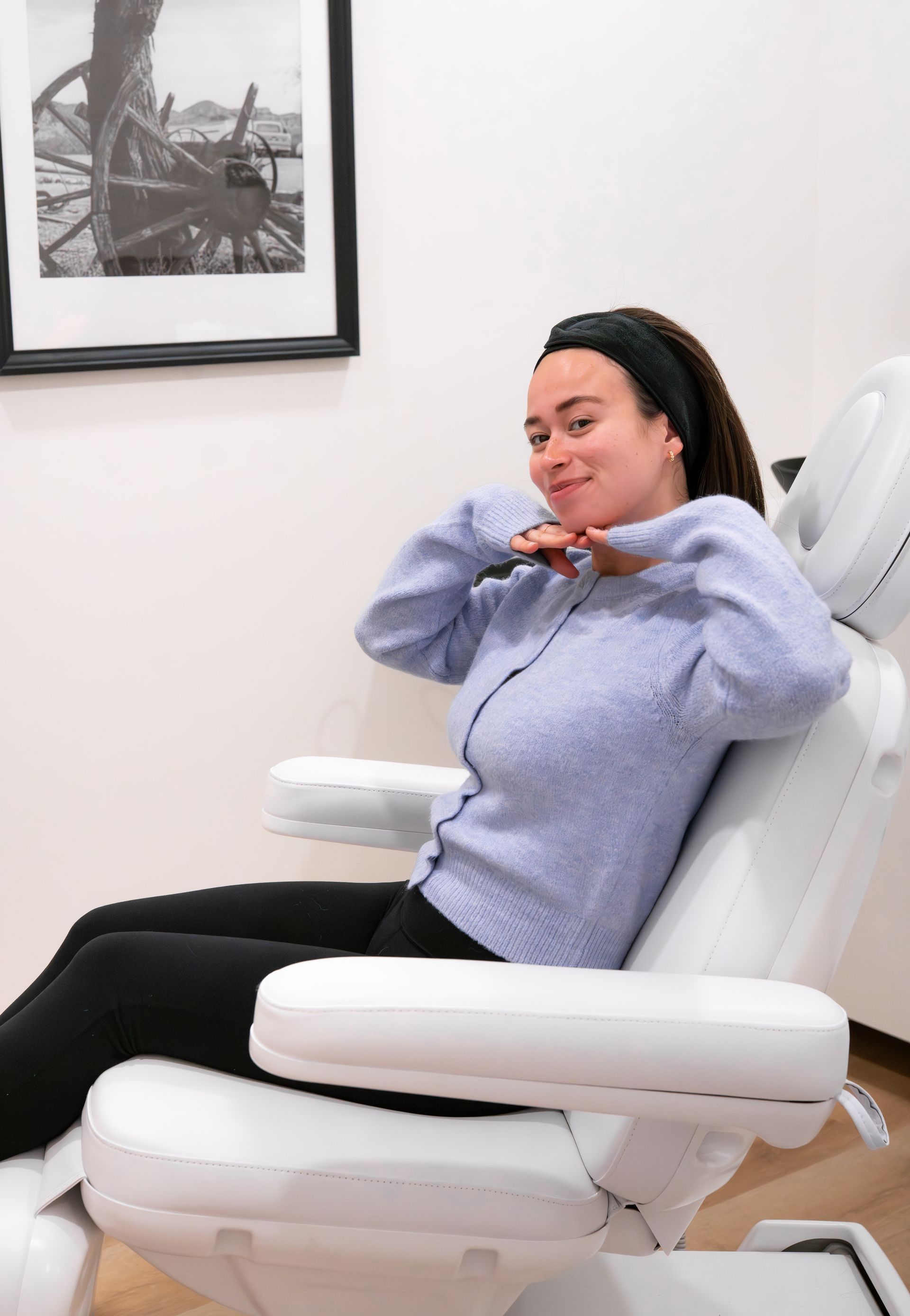a close up of a woman 's face with her eyes closed .