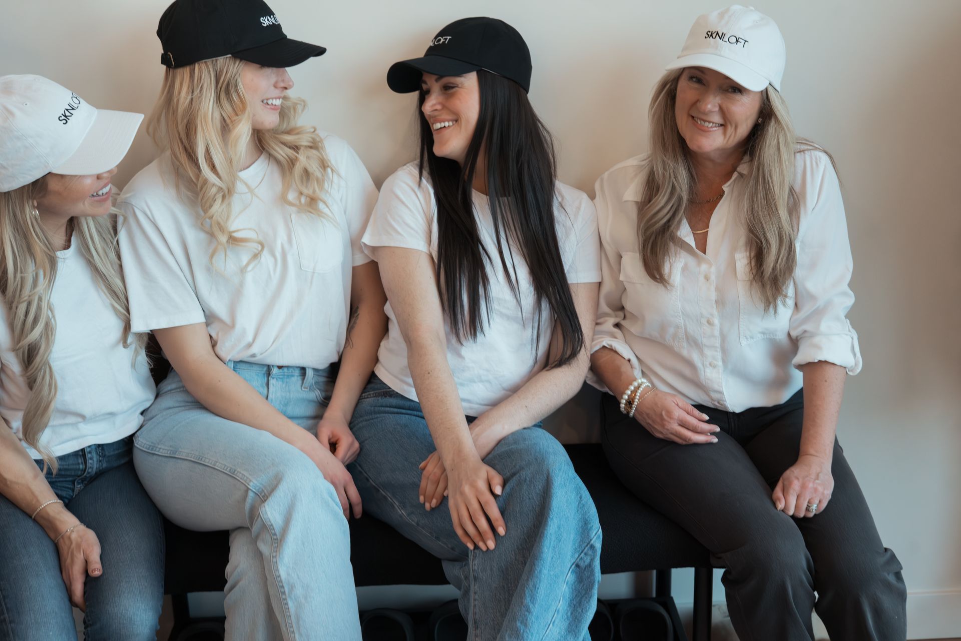 A wooden reception desk in a room with flowers on it.