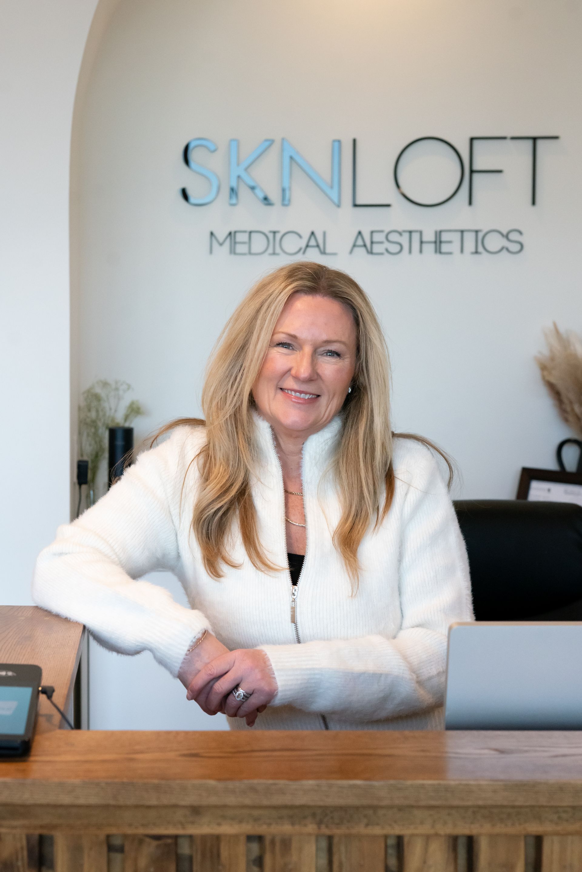 two women are standing next to each other and looking at each other .