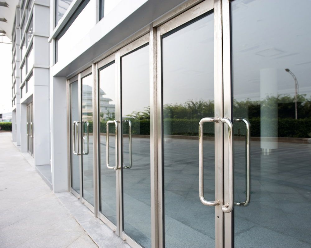A Building with a Lot of Glass Doors and Handles — Bulli Glass in Bulli, NSW