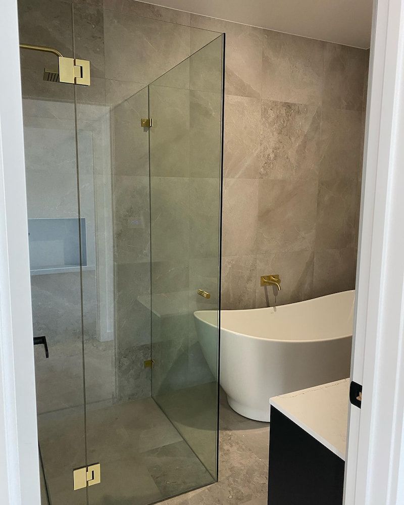 A Bathroom with a Walk in Shower and a Bathtub — Bulli Glass in Dapto, NSW