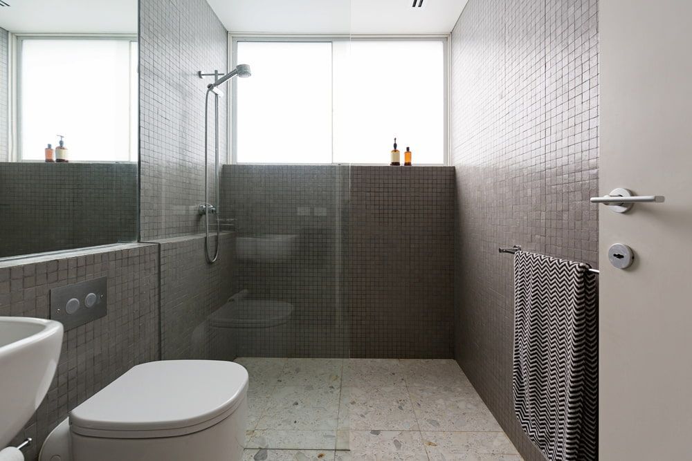 A Bathroom With a Toilet, Sink, and Walk in Shower — Bulli Glass in Kiama, NSW