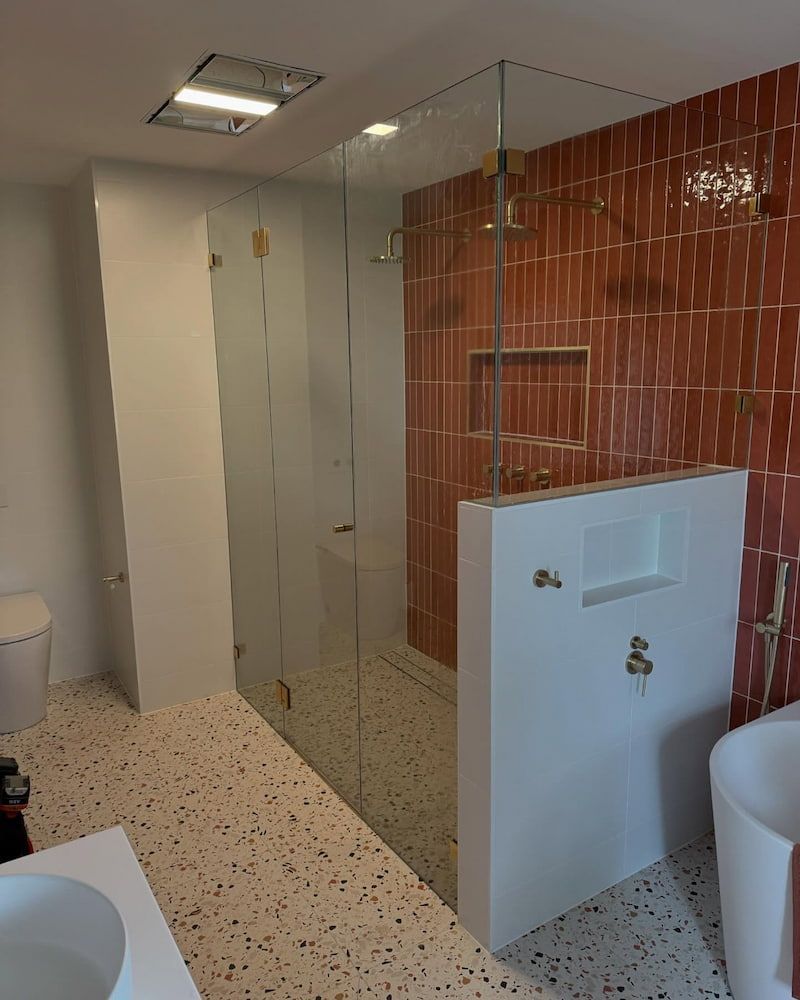 A Bathroom with a Walk in Shower, Sink, Toilet and Bathtub — Bulli Glass in Bulli, NSW