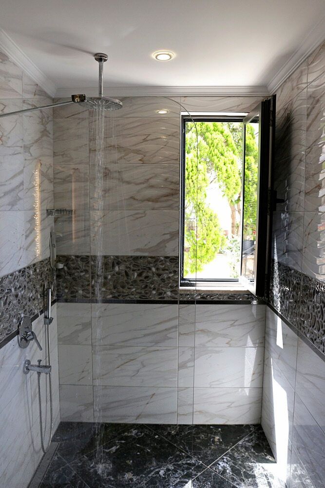 A Bathroom With a Walk in Shower and a Window — Bulli Glass in Shellharbour, NSW