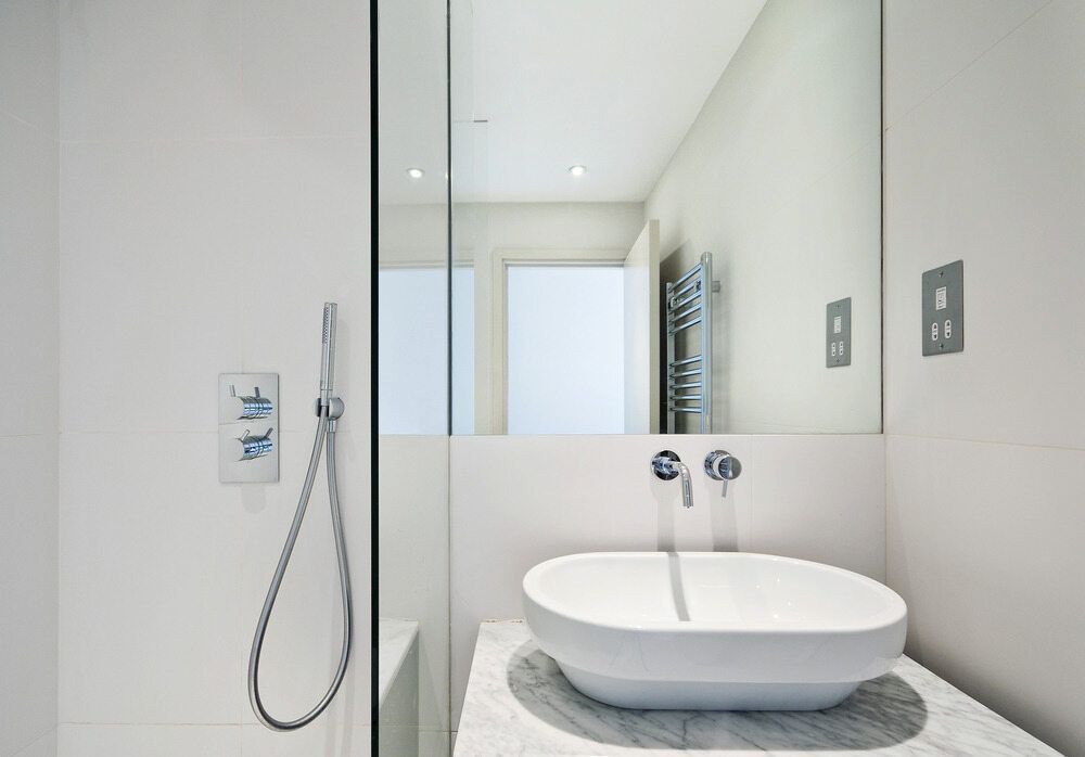 A Bathroom With a Sink, Shower and Mirror — Bulli Glass in Shellharbour, NSW