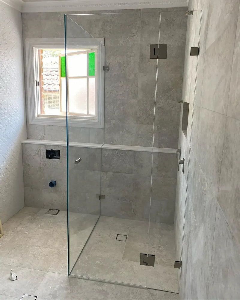A Bathroom with a Walk in Shower and a Window — Bulli Glass in Bulli, NSW