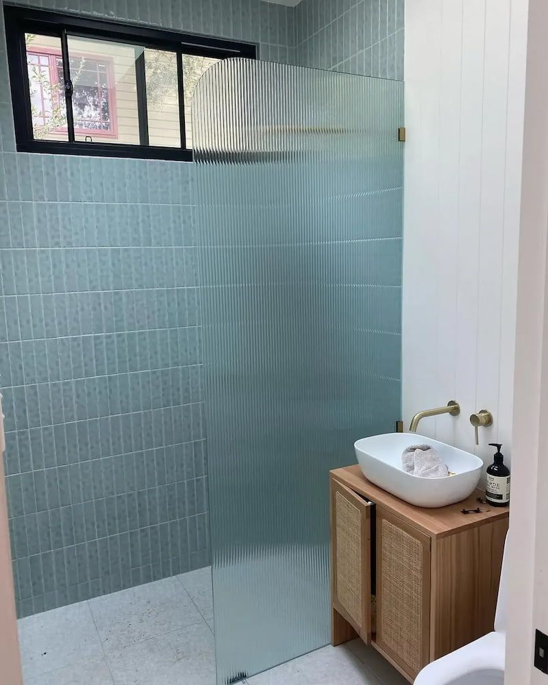 A Bathroom with a Sink, Toilet, Shower and Window — Bulli Glass in Bulli, NSW
