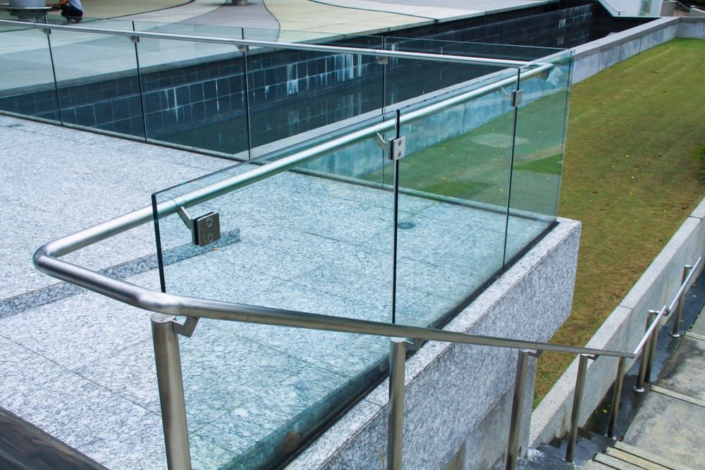 A Staircase with a Stainless Steel Railing and a Glass Railing — Bulli Glass in Bulli, NSW