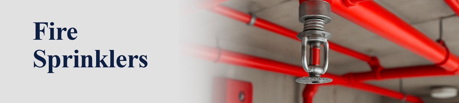 Fire sprinkler system with red pipes and a sprinkler head.