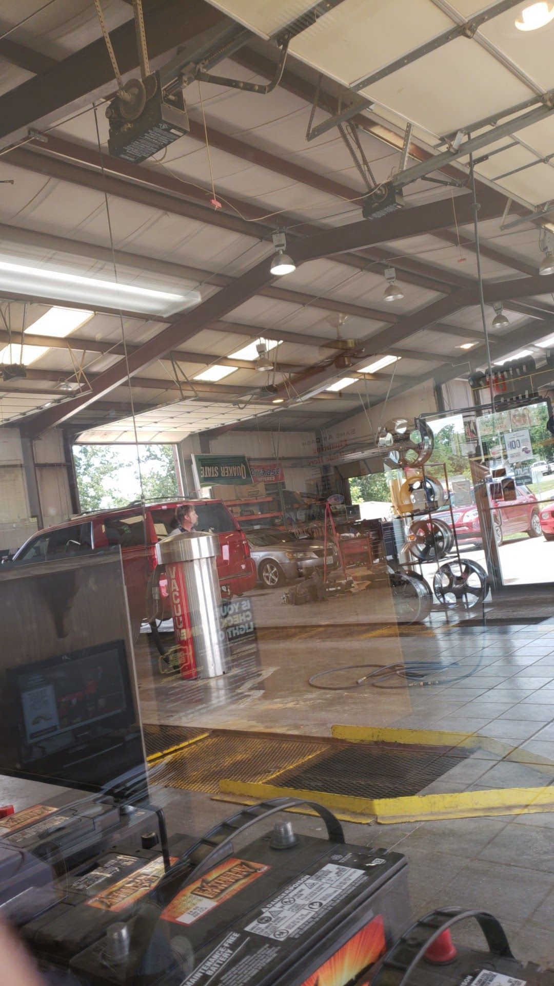 Garage through window | Pro-Lube Tire and Auto Center