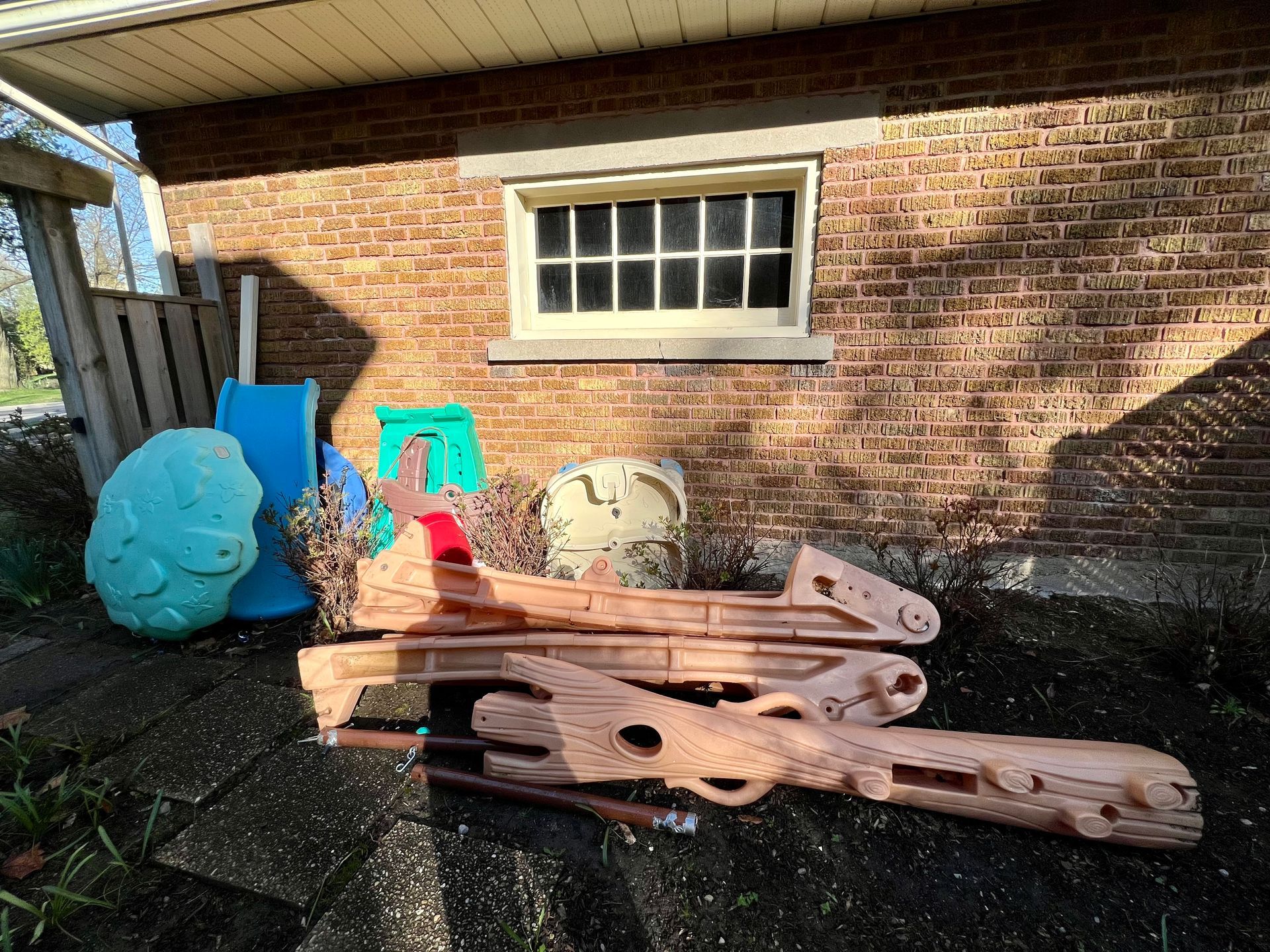 blue dumpster with leaves