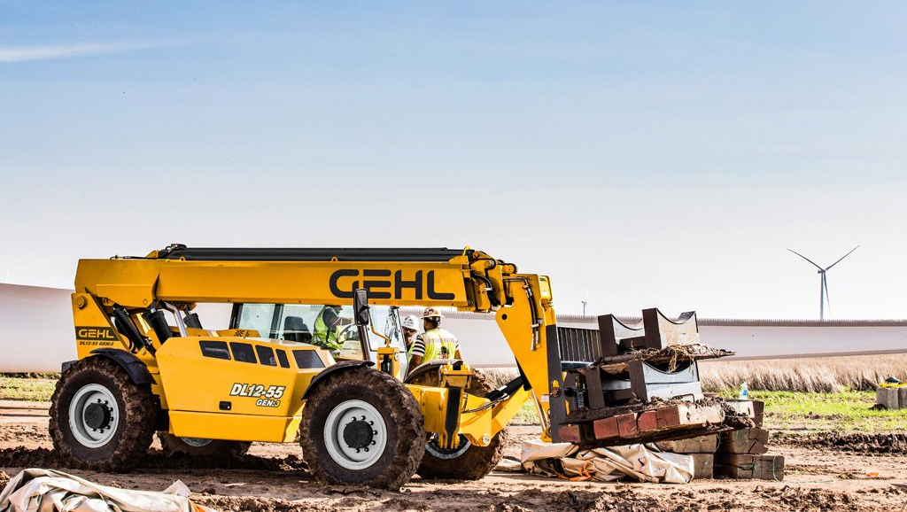 gehl dl12-55 telehandler with three construction workers on a field