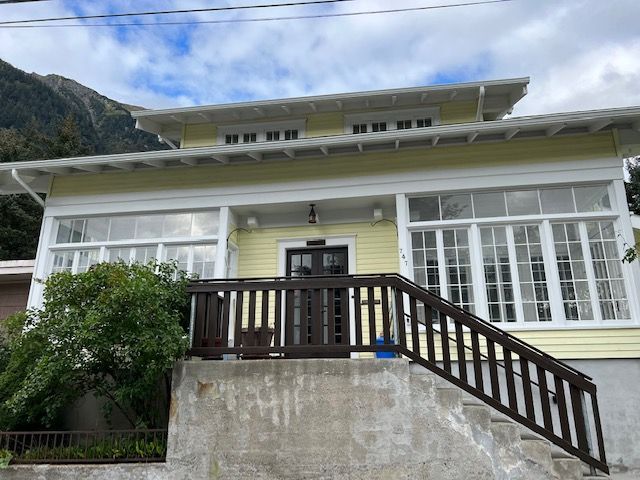 Painter Using Roller Paint To The Wall — Juneau, AK — Herr Painting, Inc.