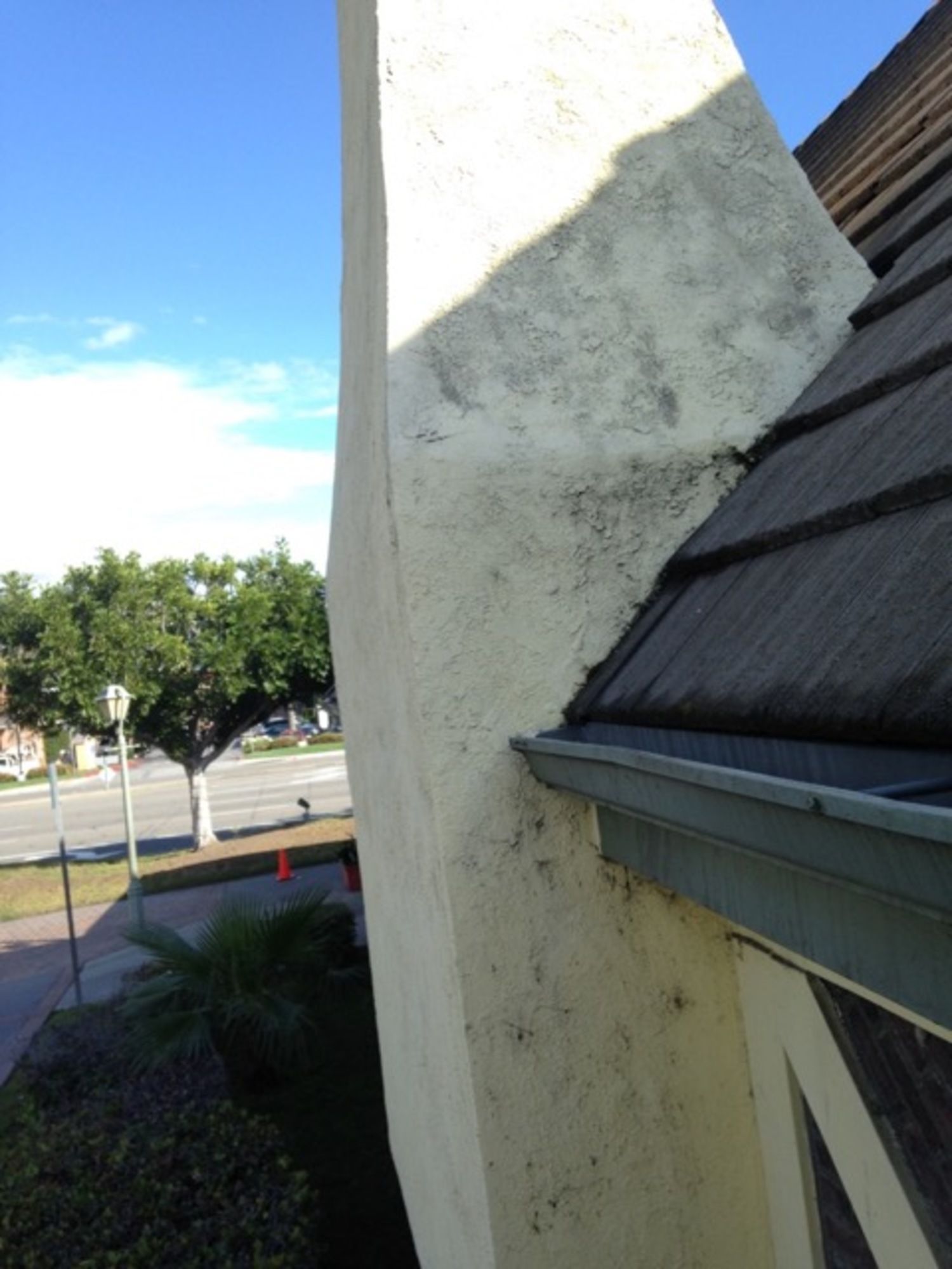 A building with a gutter on the side of it