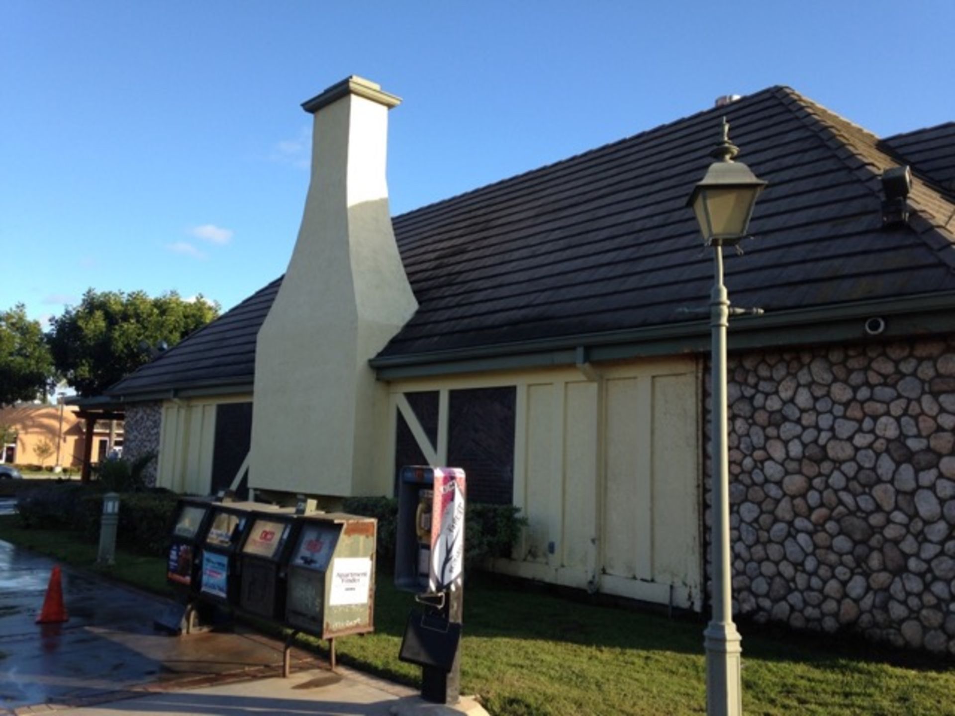A building with a chimney on the side of it