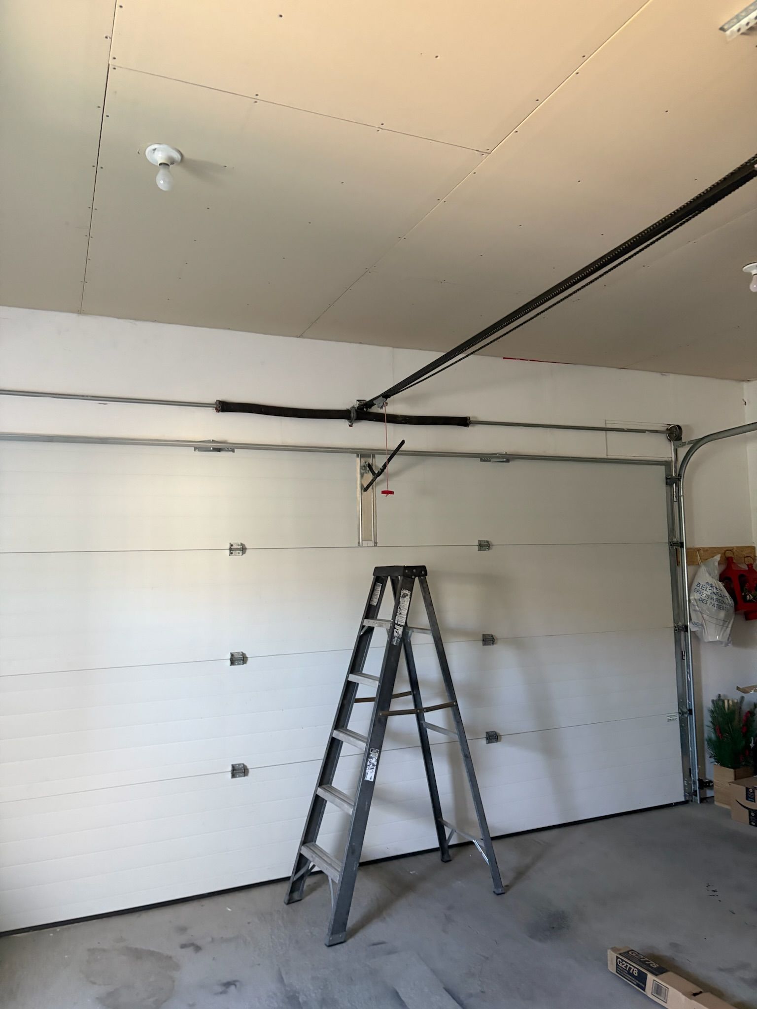 Garage interior with garage door spring repair