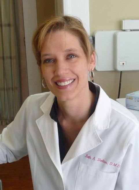 Teeth Filling — Dentist Showing Patient's X-ray in Tupelo, MS