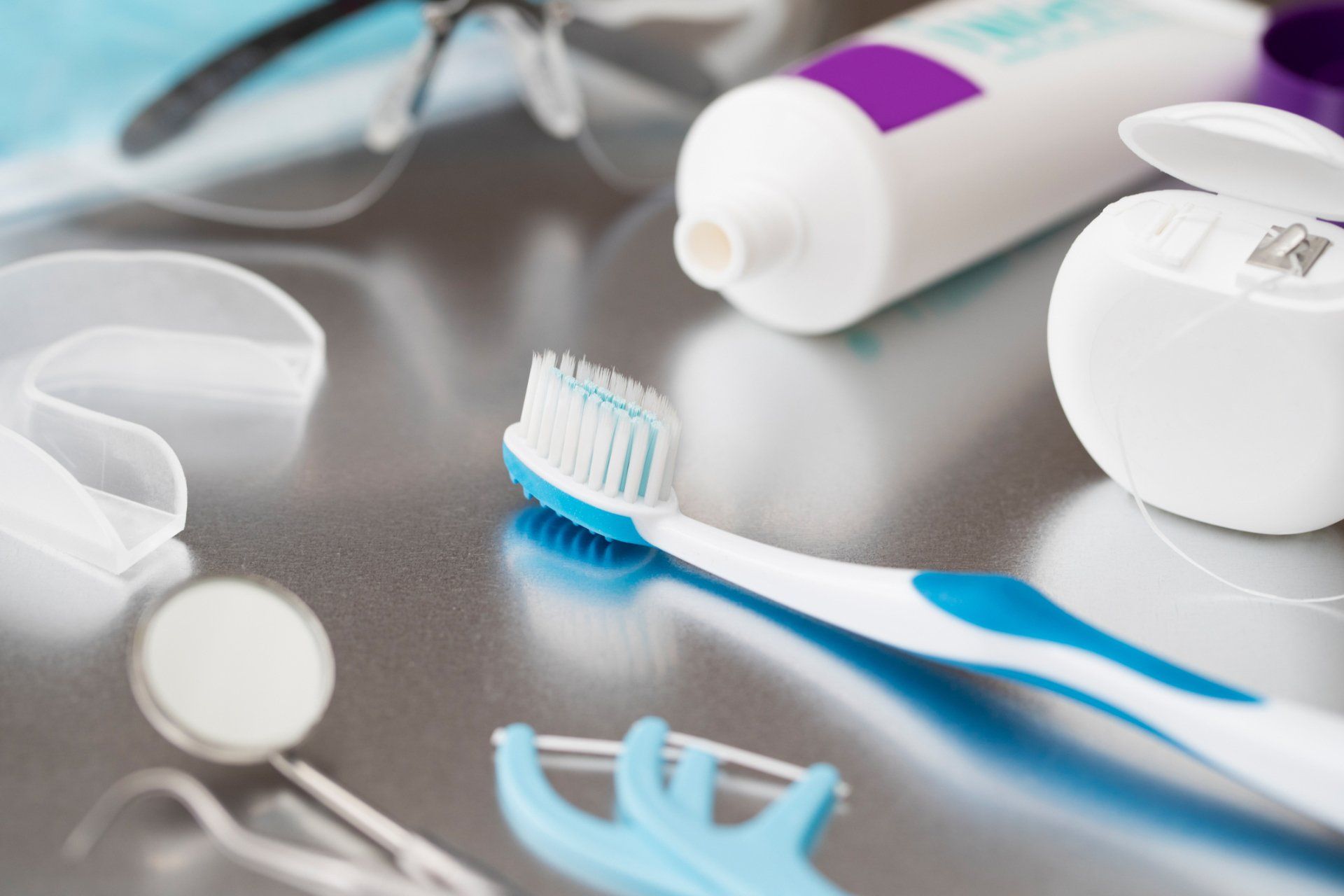 Dental Hygiene — Dentist With Male Colleague Treating Patient in Tupelo, MS Dental Hygiene — Dentist With Male Colleague Treating Patient in Tupelo, MS