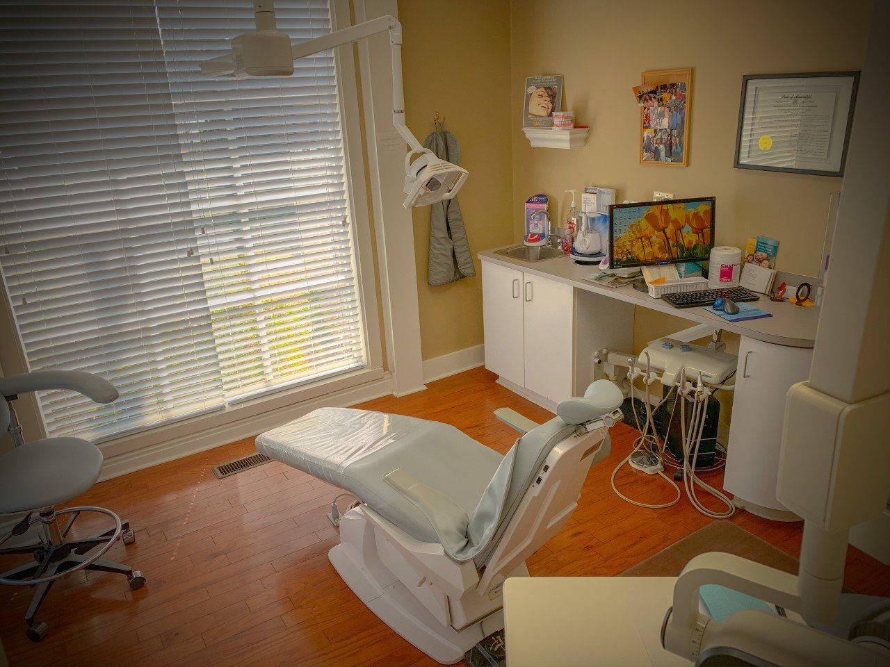 Dental Hygiene — Dentist With Male Colleague Treating Patient in Tupelo, MS