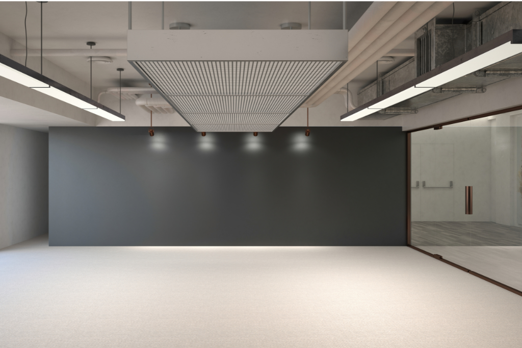 An empty room with a black wall and a white floor