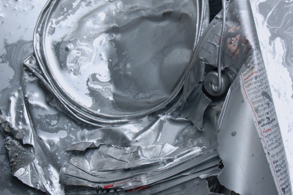 A close up of a piece of aluminum foil on a table.