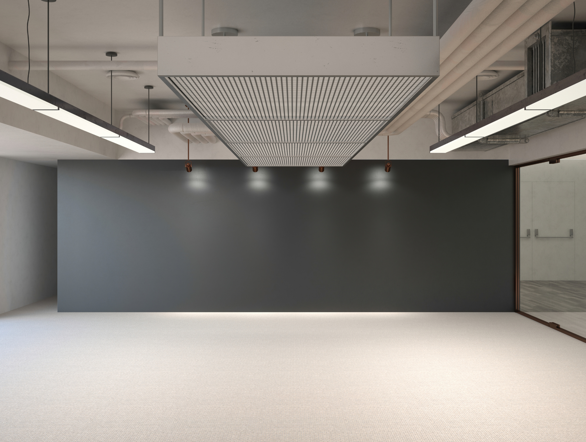 An empty room with a black wall and a ceiling light.