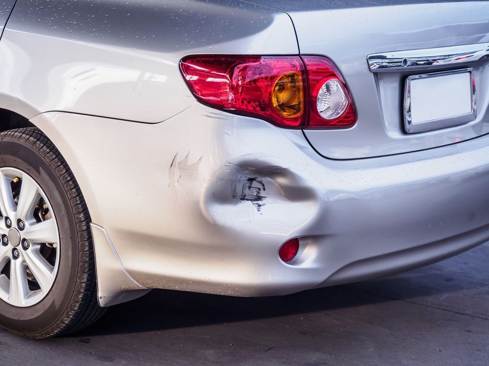 Car with a Dent on the Back Side — Vehicle Repairs in Tuncurry, NSW