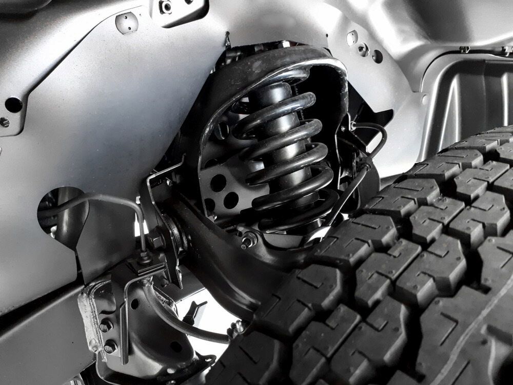 A Close Up Of A Car Suspension With A Tire — Mullumbimby Automotive in Mullumbimby, NSW