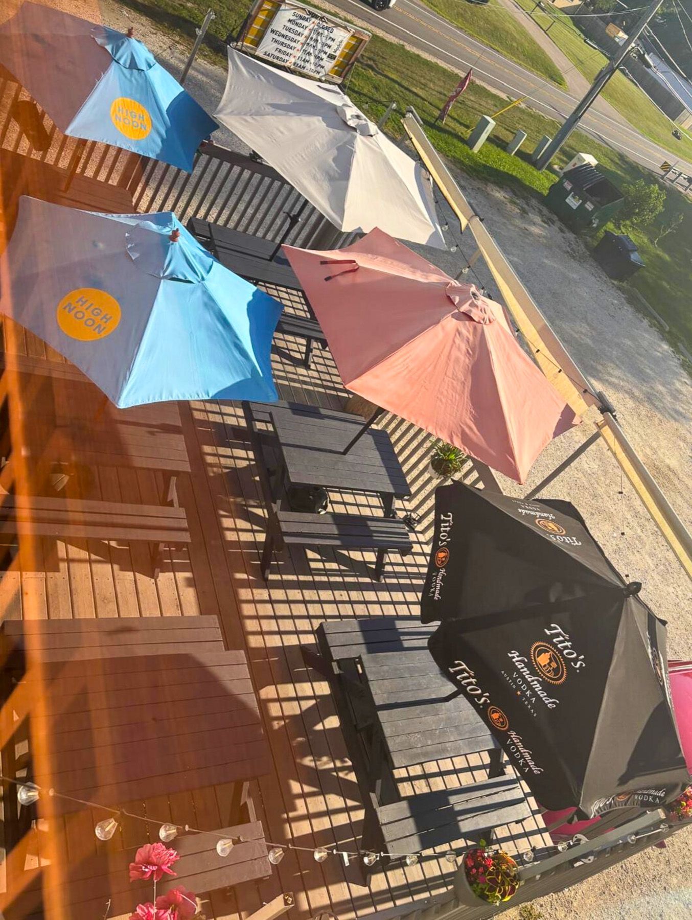 Outdoor patio tables and umbrellas at El Sureño