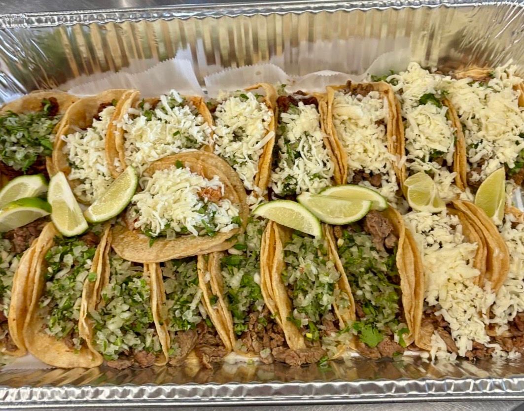 Large catering platter of tacos for a group order from El Sureño
