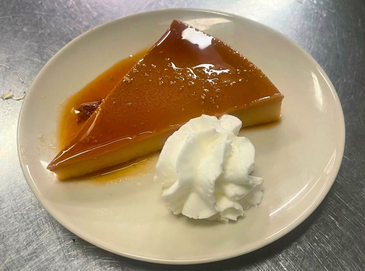 Homemade flan with whipped cream